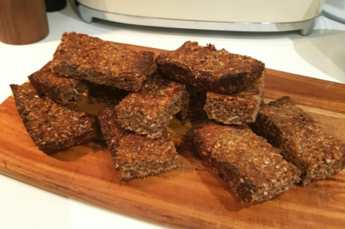 protein musli bars on wooden cutting board