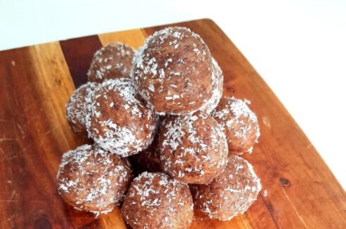 protein balls on wooden cutting board